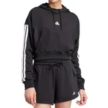 A person wears a black Adidas hoodie with white stripes on the sleeves and black shorts featuring the Adidas logo.