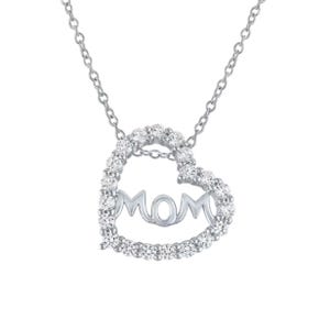 Heart-shaped pendant necklace with \“MOM\“ inside, adorned with small diamonds on a silver chain.