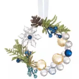 This is a decorative holiday wreath ornament featuring clear, blue, and gold faceted beads, adorned with green foliage, a pinecone, and a crystal-like snowflake design.