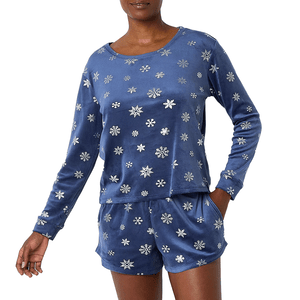 Blue long-sleeve top and shorts with snowflake pattern, made of velvet-like fabric, featuring pockets.