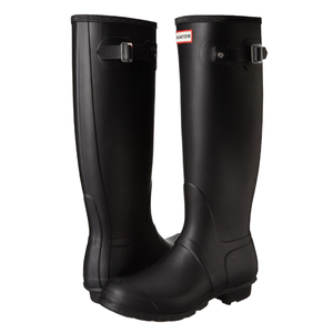 A pair of black tall rubber rain boots with adjustable buckle straps near the top, featuring the word \“Hunter\“ on the front.