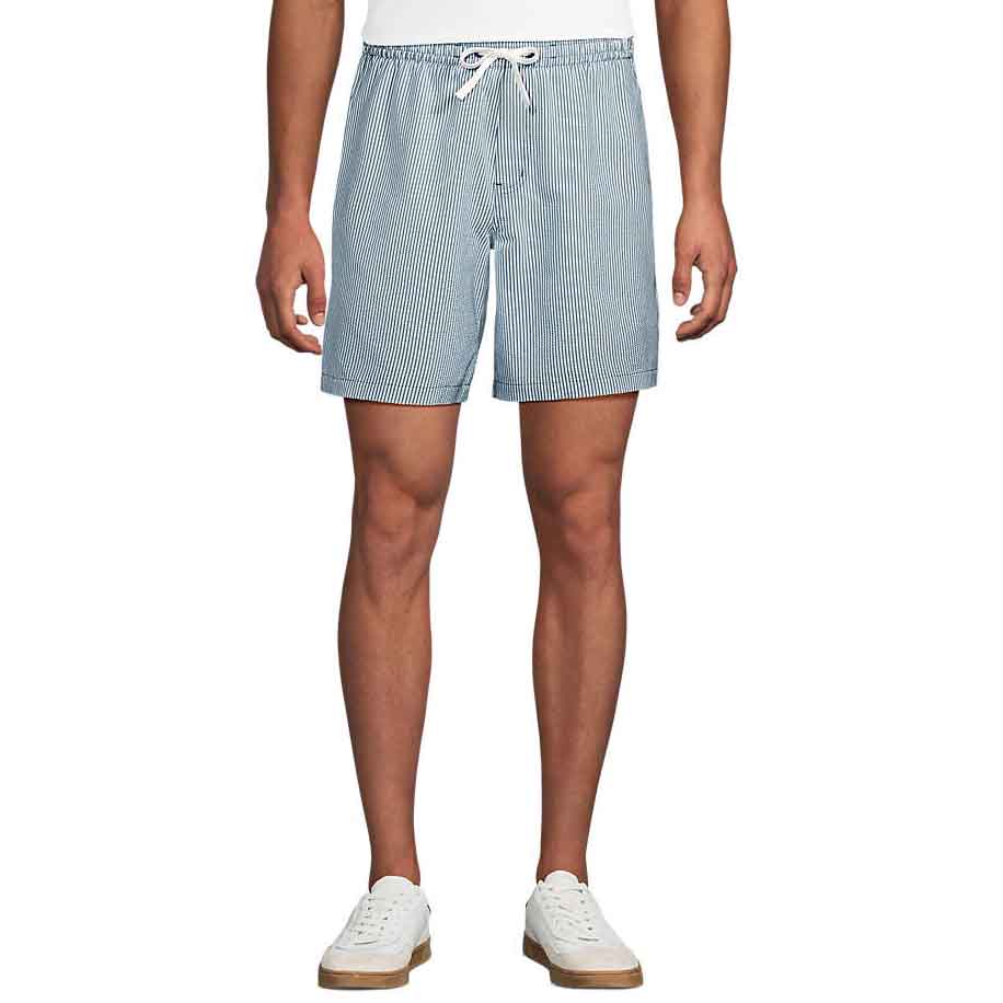 Lands' End Beach to Board Shorts feature a mid-thigh length with a drawstring waistband and blue and white pinstripes. They are paired with white sneakers, offering a casual, versatile style suitable for beach or casual wear.
