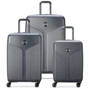 3-piece Delsey Paris hardside luggage set in metallic gray with a textured, ribbed design. Each suitcase features telescopic handles and four spinner wheels; available in small, medium, and large sizes for versatile packing needs.