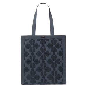 A navy blue tote bag featuring a floral pattern with two handles.