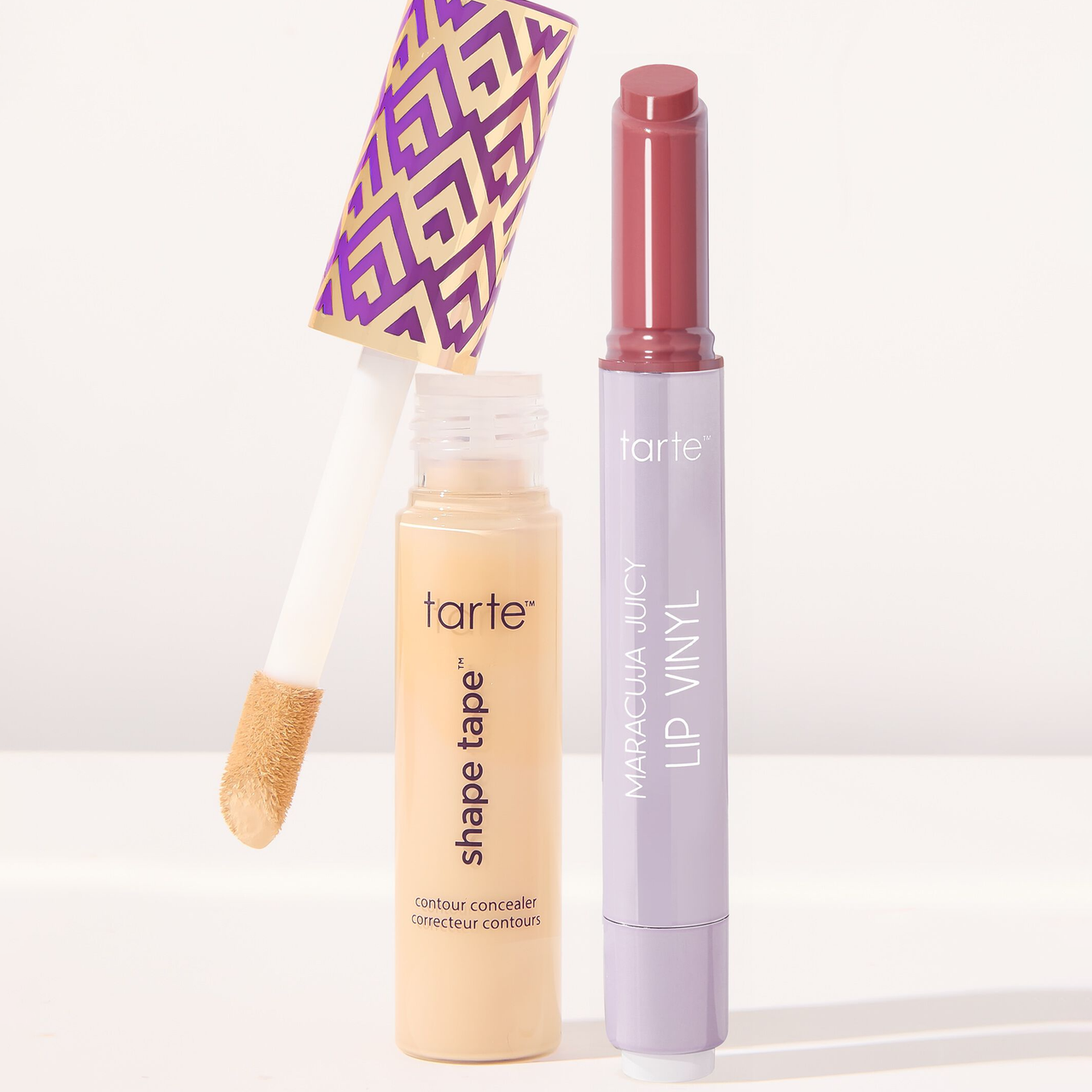 Tarte Shape Tape Concealer & Lip Set includes a contour concealer with a patterned cap and a Maracuja Juicy Lip Vinyl in a sleek, lavender tube.