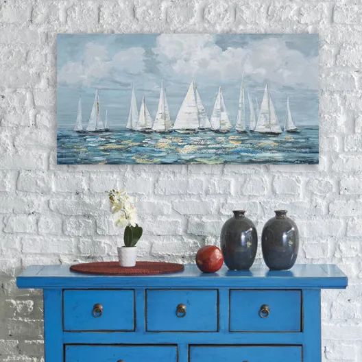 Vibrant blue console table with two vases, a flowerpot, a woven placemat, and a piece of fruit, set against a white brick wall with a sailboat painting above.