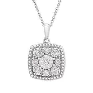 A sterling silver necklace features a cushion-shaped pendant embellished with multiple small diamonds encircling a larger central diamond, and intricate beaded detailing on a delicate silver chain.