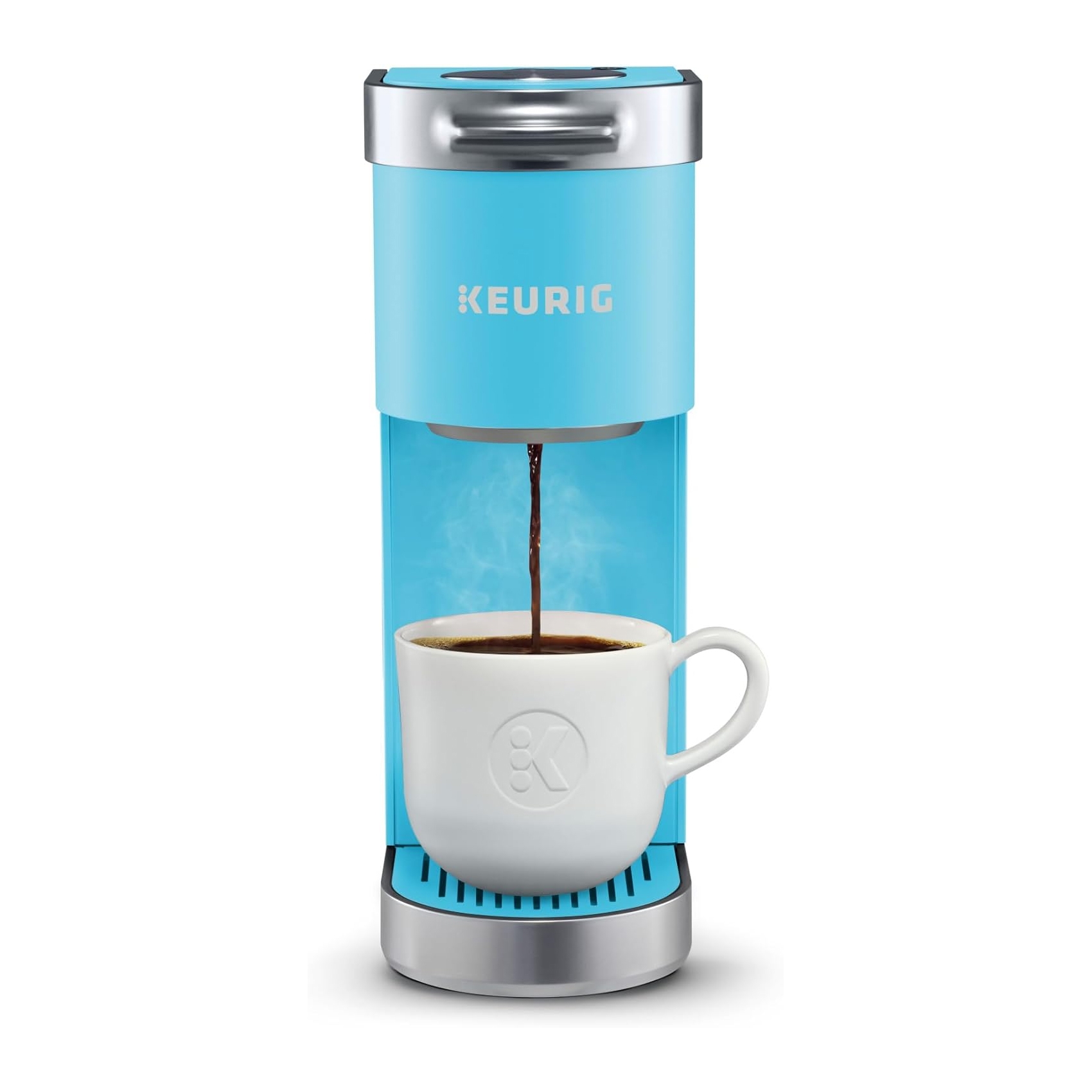 A light blue Keurig single-serve coffee maker with a white mug underneath, brewing coffee.