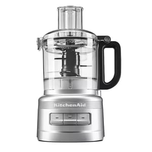 KitchenAid 7-Cup Food Processor in silver, featuring a transparent work bowl with a black handle, simple control buttons for low, high, and off/pulse settings, and a wide feed tube for easy ingredient addition.