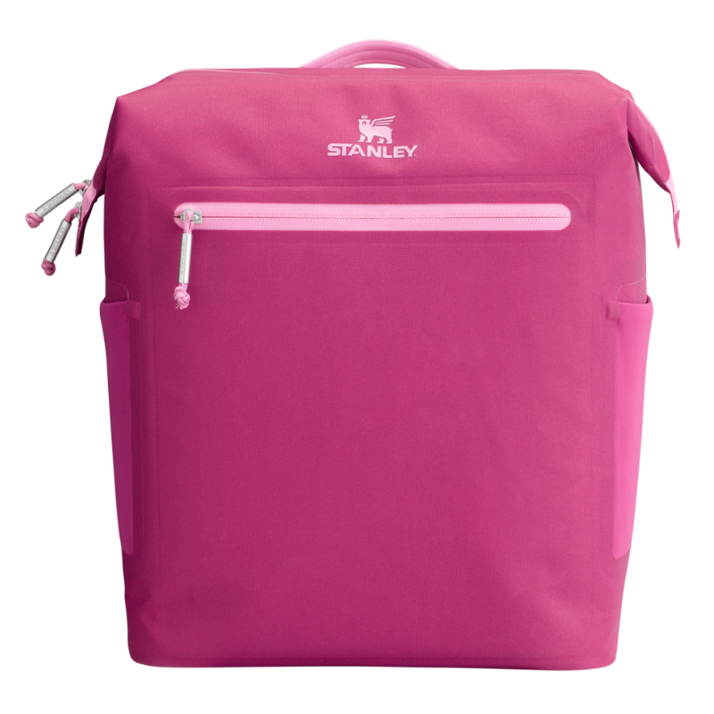 Pink Stanley cooler backpack with a front zipper pocket, side handles, and a logo on the front.