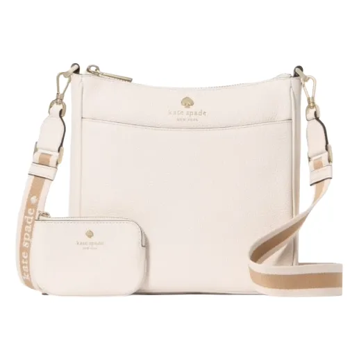A cream-colored Kate Spade crossbody bag with a matching small pouch, featuring a striped strap with the brand's name.