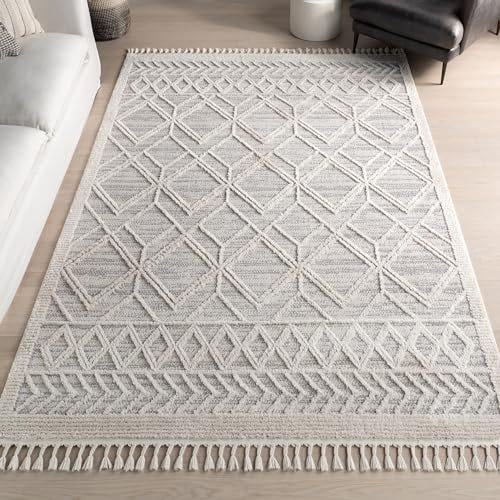 A rectangular rug with a gray and white geometric lattice pattern and tassels along the shorter edges.