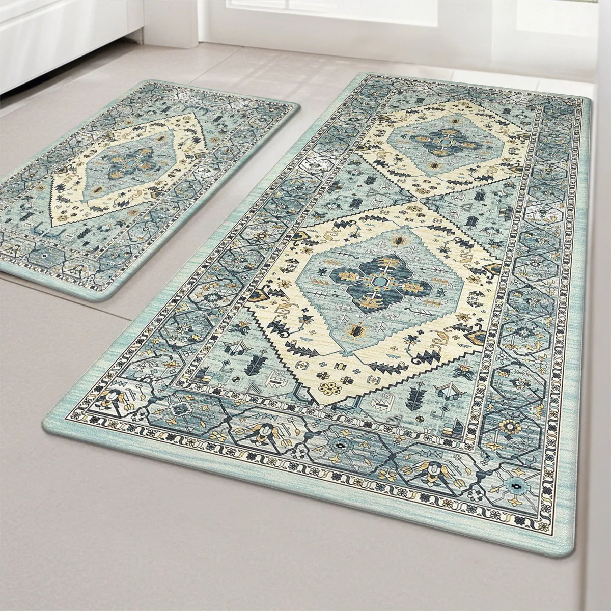 A set of two decorative area rugs featuring a vintage-style geometric pattern in light blue and cream tones, placed on a tiled floor.