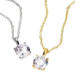 Two necklaces with round clear gemstones: one with a silver chain and setting, the other with a gold chain and setting.