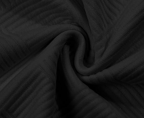 A close-up of black ribbed fabric, showing its texture and swirl pattern.