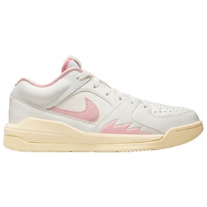 Nike Jordan Stadium 90 Shoes feature a low-top design with a white base, pink Swoosh, and accents on the sides. They have a cream-colored sole and a subtle retro-inspired silhouette, combining casual style with sporty elements.