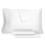 White pillowcase, fitted sheet, and flat sheet set with a simple, elegant design.