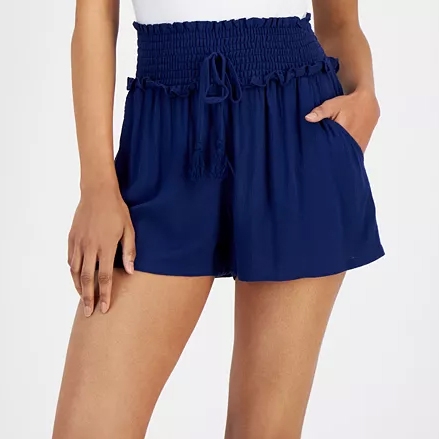 Navy blue shorts with a smocked waistband and tassel drawstring, featuring side pockets.
