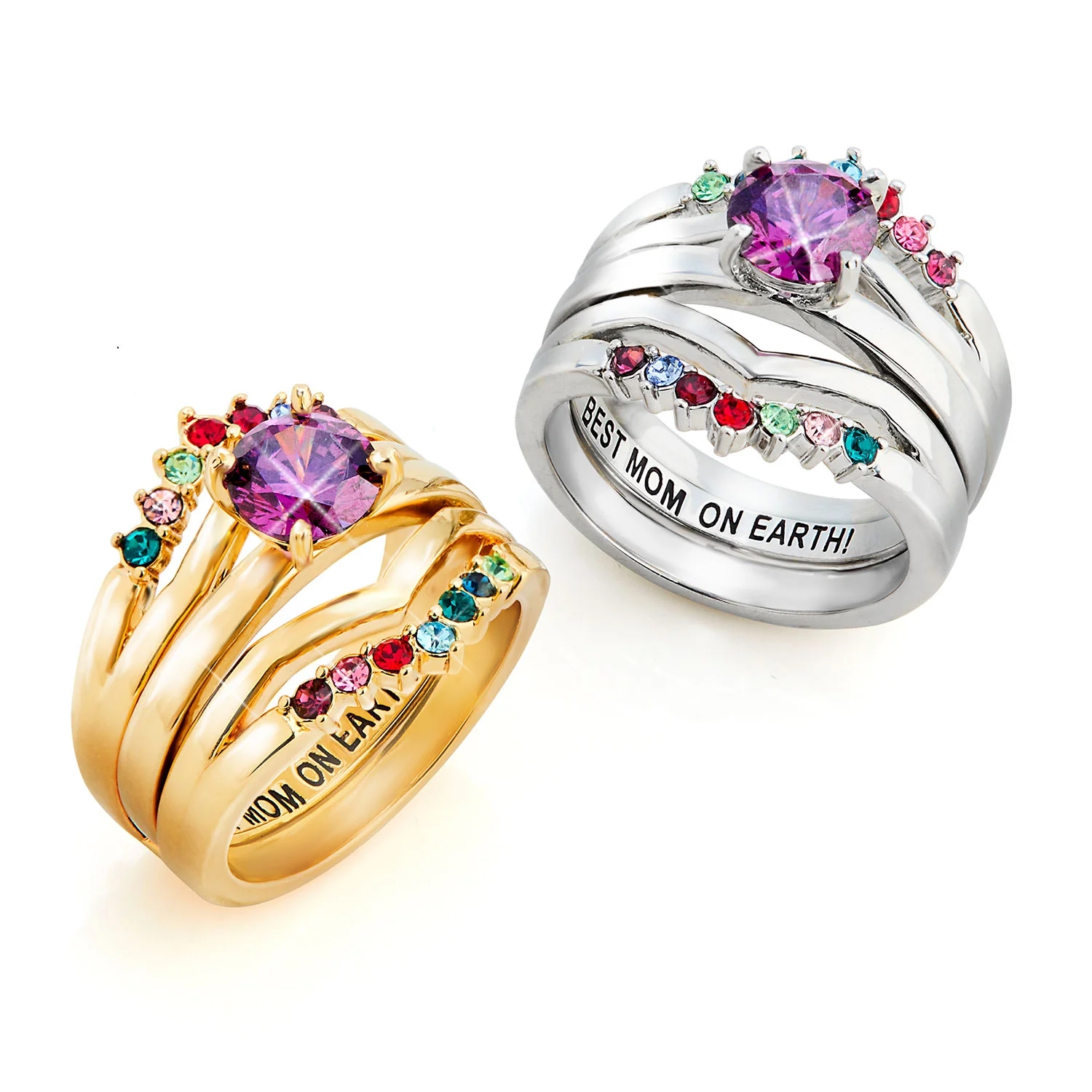 Two ring sets, one in gold and the other in silver, each featuring a large purple stone surrounded by colorful smaller birthstones. Both rings are engraved with \“BEST MOM ON EARTH!\“ on the inside.