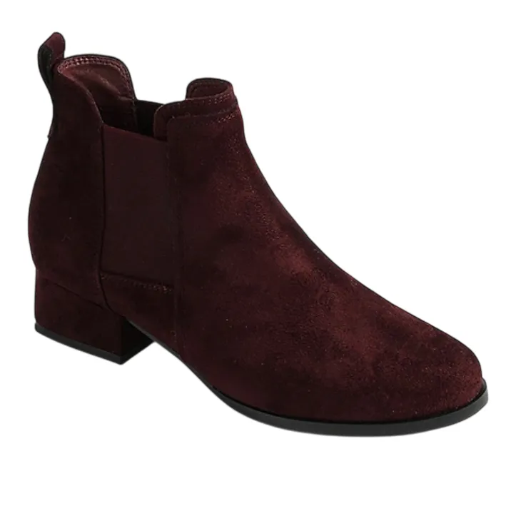 A maroon suede Chelsea boot with a low block heel and elastic side panels.