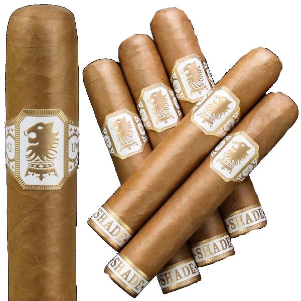 A collection of cigars with a light brown wrapper, featuring a white and gold band with a lion emblem and the word \“Shade\“ visible at the bottom.
