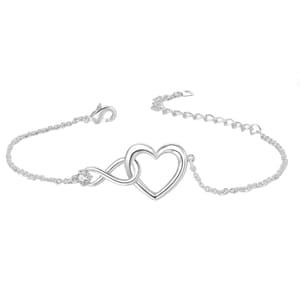 A delicate chain bracelet featuring a silver-tone heart intertwined with an infinity symbol, secured by a lobster clasp.