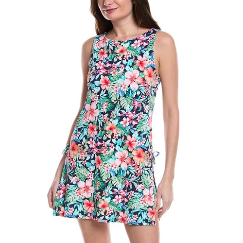 A sleeveless romper with a vibrant floral pattern featuring pink and coral flowers against a dark background, designed by Tommy Bahama. It has a round neckline and a relaxed fit, offering a casual and tropical style.