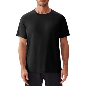 A black, short-sleeve, men’s sun-protection shirt with a crew neck and raglan sleeves, designed for comfort and coverage.