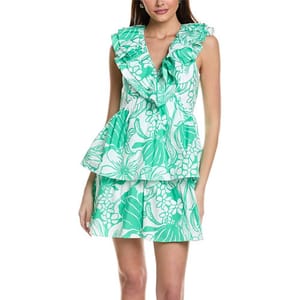 A green and white floral mini dress featuring a ruffled v-neck, sleeveless design, and a tiered skirt with a fitted waist.