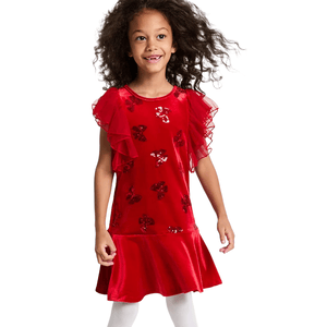 A young girl is wearing a red dress with ruffled sleeves and butterfly sequin accents, paired with white tights.