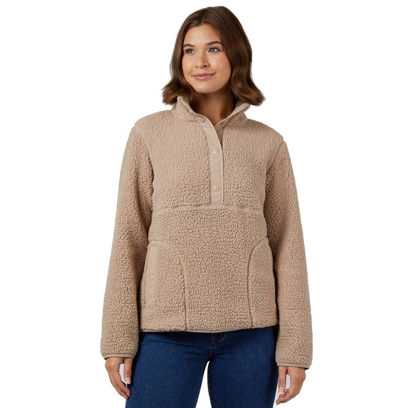 A beige sherpa pullover with a half-button front, high collar, and kangaroo pocket, paired with blue jeans.