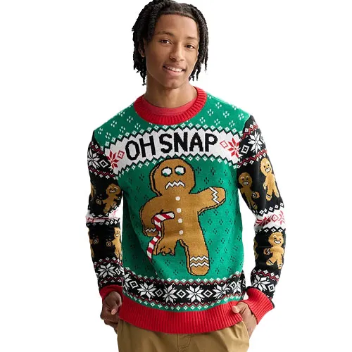 A person is wearing a festive sweater featuring a gingerbread man with a broken leg and the phrase \“OH SNAP\“ in a holiday-themed design.
