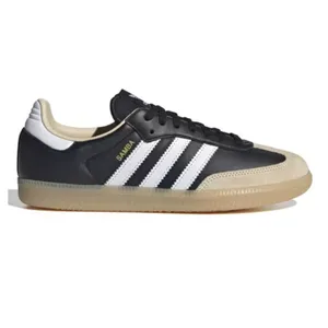 Black Adidas Samba sneaker with white stripes and a gum sole, featuring \“SAMBA\“ text in gold on the side.