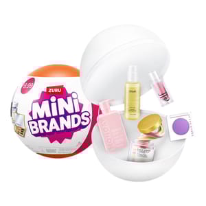 A Zuru Mini Brands capsule opened to reveal miniature beauty products including shampoo, oil, and makeup items.