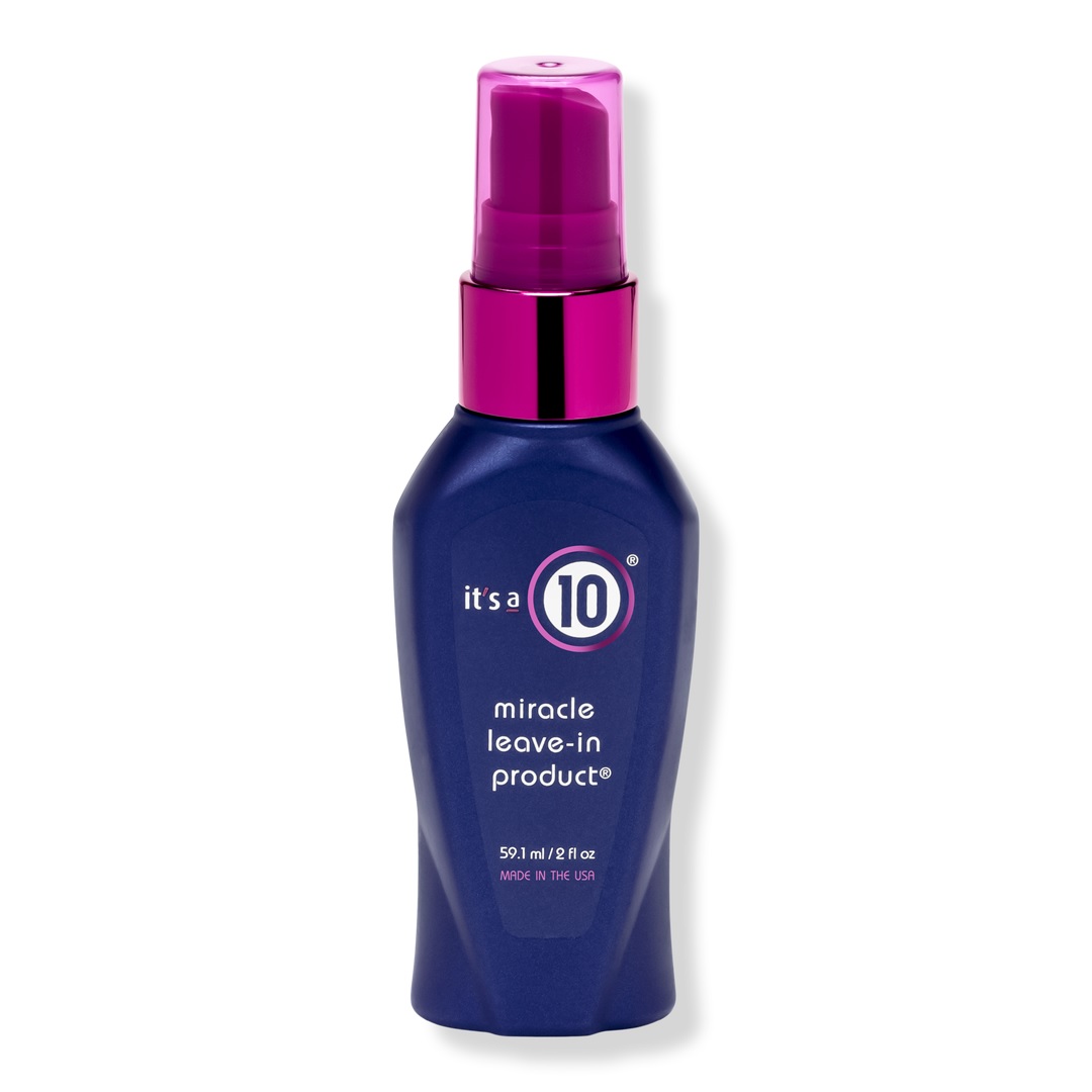 It's A 10 Travel Size Miracle Leave-In is a 2 fl oz hair treatment in a blue spray bottle with a pink cap, designed to address hair issues like frizz, tangles, and damage, promoting smoothness and shine. Made in the USA.