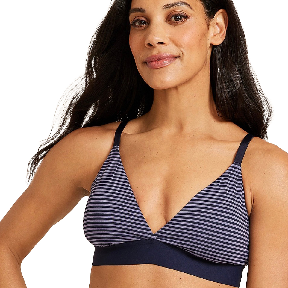 A woman is wearing a navy and white striped bralette with thin straps and a solid navy band.