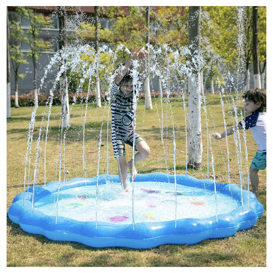 Two children playing in a blue inflatable water sprinkler pad outdoors.