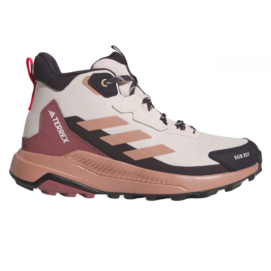 Adidas Terrex Anylander Hiking Shoes are designed for outdoor activities, featuring a mid-top design in beige, pink, and black with a durable sole for traction. They offer a lightweight feel and are equipped with RAIN.RDY technology for water resistance.