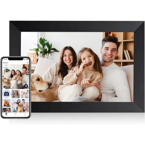 A 10-inch digital photo frame displays a family photo, featuring a couple, a child eating a cookie, and a dog. A smartphone is shown nearby with an app interface for selecting and displaying photos on the frame.