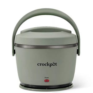 A portable Crockpot lunch warmer with a handle and power indicator, designed for warming meals on the go.