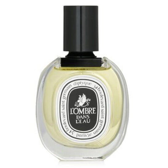 Diptyque L'Ombre Dans L'Eau Eau de Toilette features a transparent oval bottle with a black cap, displaying a classic label. The fragrance is known for its blend of blackcurrant leaves and Bulgarian rose.