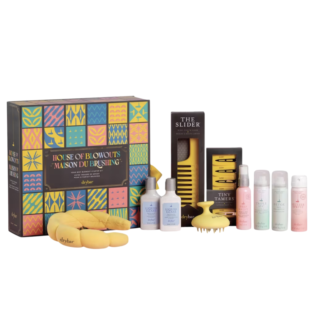 Drybar House of Blowouts Kit includes a variety of haircare items: a Liquid Glass, a wide-tooth comb, hair clips, a scalp brush, and travel-size sprays such as Triple Sec, Detox Dry Shampoo, and Seltzer Spritz.