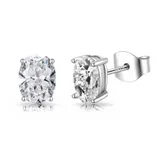 A pair of oval-cut clear gemstone stud earrings set in a four-prong silver setting with butterfly backs, marked \“S925\“ indicating sterling silver.