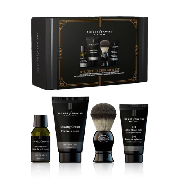 A shaving kit featuring pre-shave oil, shaving cream, a shaving brush, and after-shave balm, all unscented, packaged in a gift box.