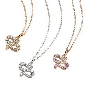 The Nadri Serpent Necklace features snake-shaped pendants adorned with sparkling stones, available in three metal finishes: gold, silver, and rose gold. Each pendant has a unique arrangement of clear and pink stones.
