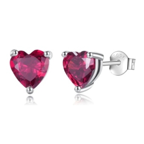 Pair of heart-shaped red gemstone stud earrings with silver prong settings and butterfly backs, marked \“925\“ indicating sterling silver.
