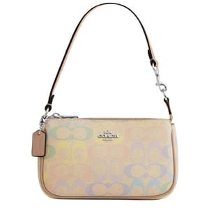 A Coach handbag with a pastel multicolored pattern, featuring a small leather tag, silver-tone hardware, and a single shoulder strap.
