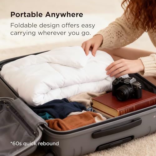 A person packs a foldable white comforter, books, and a camera into a suitcase. The design claims a 60-second quick rebound for easy portability.