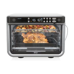 Refurbished Ninja Foodi 10-in-1 oven with functionalities like air frying, roasting, and baking. It features a digital display, control panel, and includes accessories for cooking various foods like chicken and vegetables.