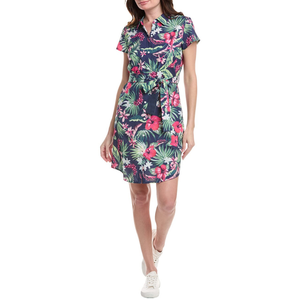 A navy blue shirtdress with a vibrant tropical floral print, featuring a collared neckline, short sleeves, and a waist tie. The dress is paired with white sneakers, creating a casual yet stylish look.